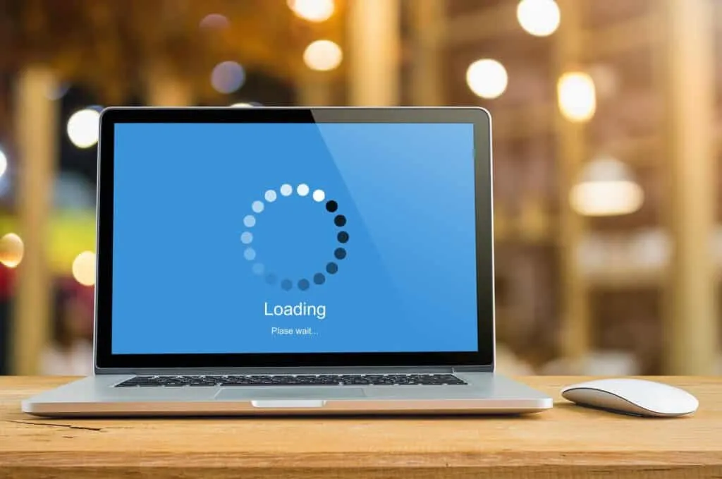 Laptop showing a loading screen to represent slow hosting being replaced by a faster setup